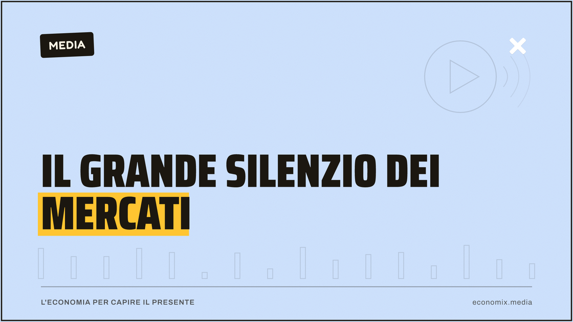 Schermo con grafici di borsa in un ufficio buio